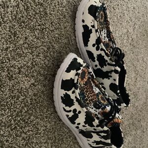 Hey Dude Black and White Cow Print Flats